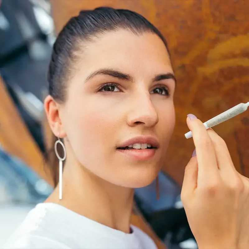 Woman smoking outside