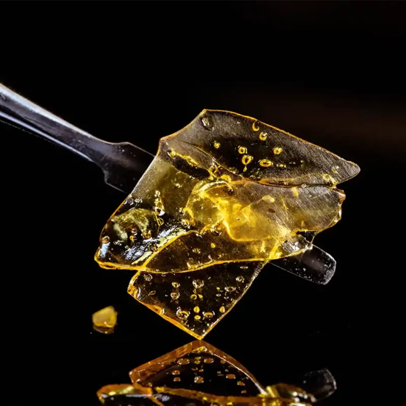 Close up of a cannabis dab in a black background