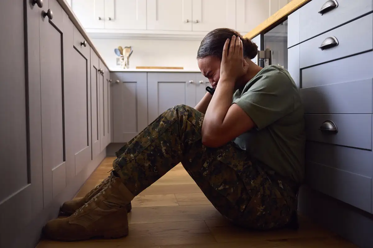 Depressed female soldier in uniform