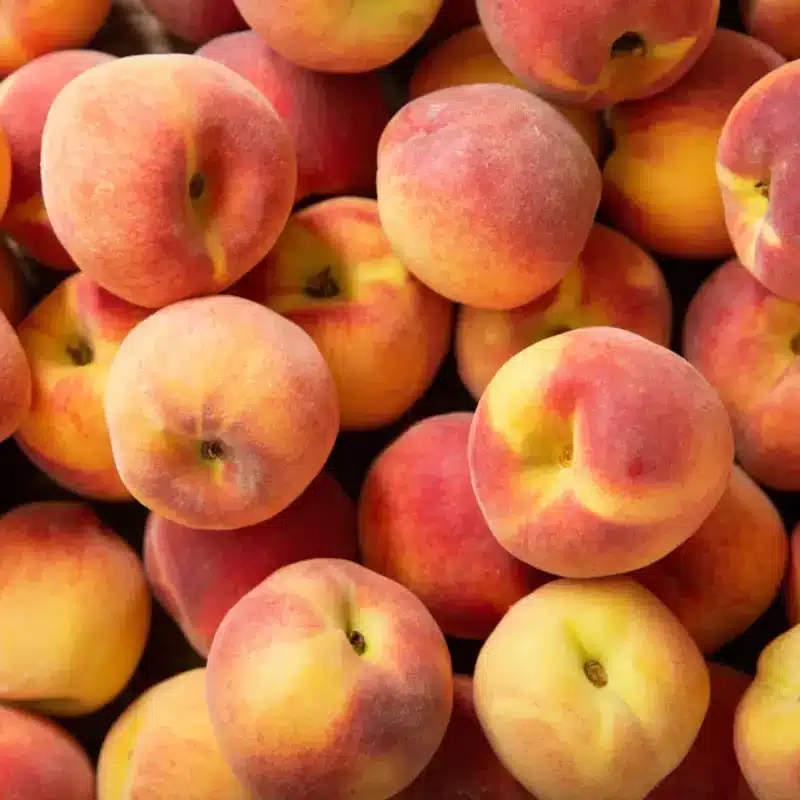 Fresh ripe peaches as background