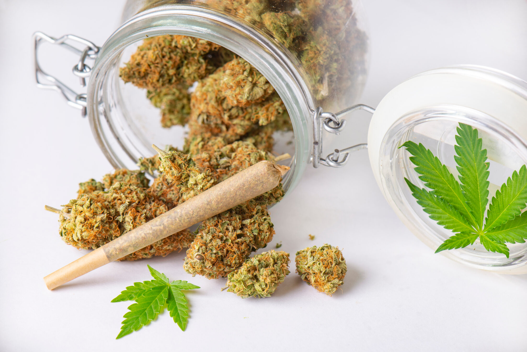 Cannabis Buds And Joint On Clear Glass Jar