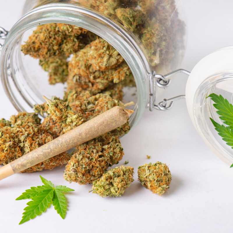 Cannabis Buds And Joint On Clear Glass Jar