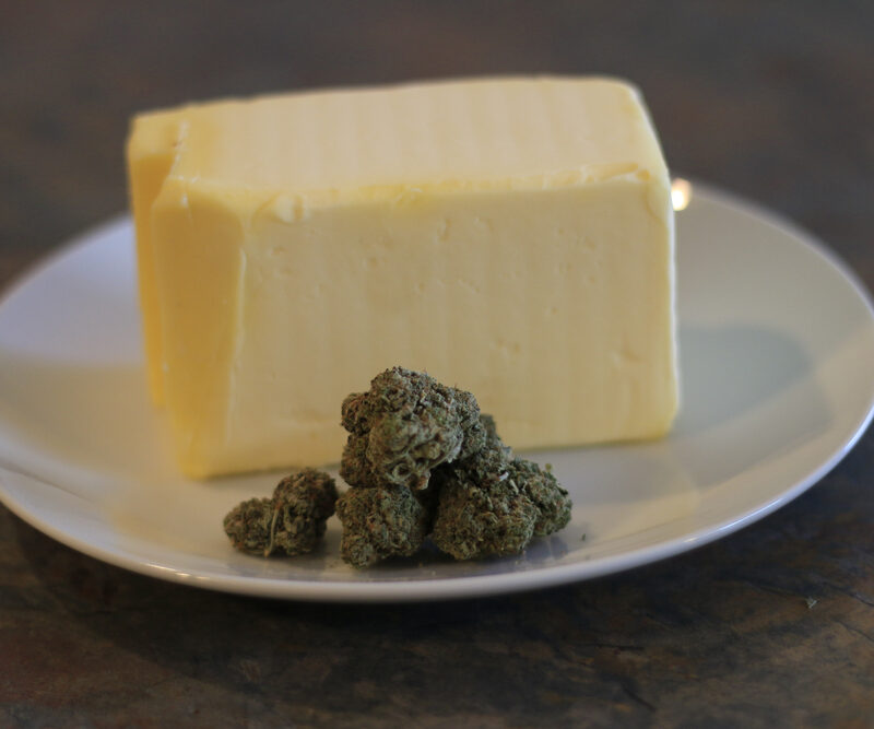 Cannabutter Process Of Making Buds Of Marijuana In Front Of